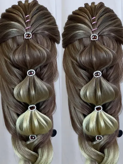 A close-up of the unique open hairstyle with bubble elements.
