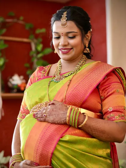 A close-up of this mom-to-be's radiant glow. The makeup is soft and warm, highlighting her happiness during her baby shower.