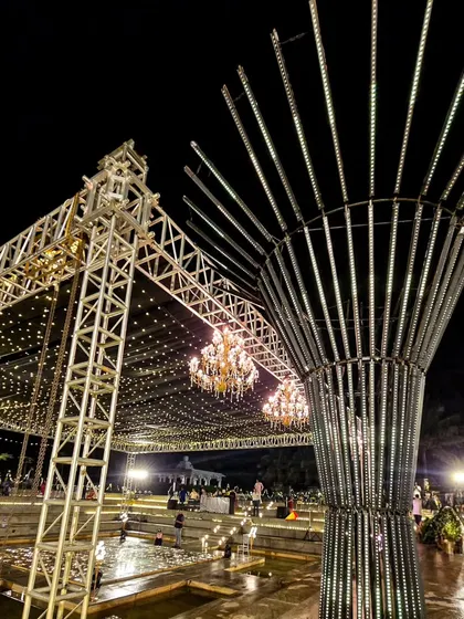 Another view of the massive sangeet production, highlighting the truss, lighting structure, and the central LED tree.