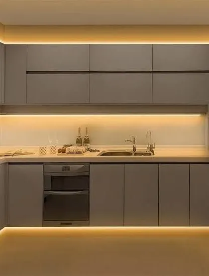 An example of innovative kitchen design featuring under-cabinet and toe-kick LED lighting for a modern, ambient effect.