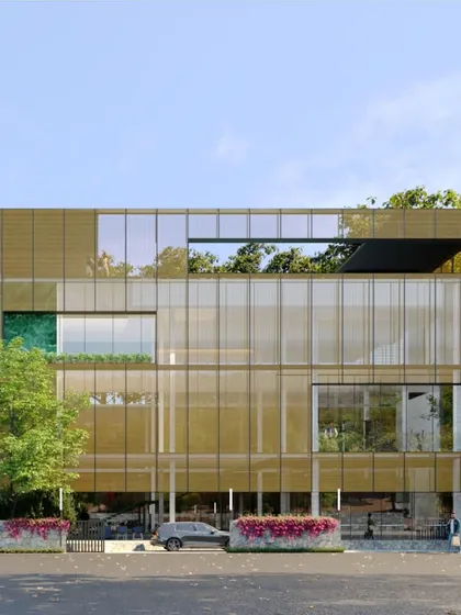 This clubhouse for an ultra luxury villa project blurs the lines between indoor and outdoor spaces. Wrapped in a bronze metal mesh, the minimalist "cube" serves as a gateway to the community and a hub for social activity.