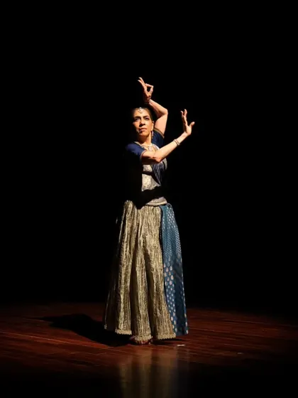 A dancer in a dynamic pose during the "Immersed" performance.