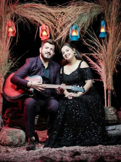 A creative pre-wedding setup with a guitar and rustic decor. This shows how we can incorporate your personal interests into the shoot.