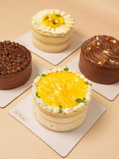 A lineup of last month's bestsellers, including my Mango Coconut, Decadent Chocolate, Mango Vanilla, and Belgian Chocolate Crunch cakes.