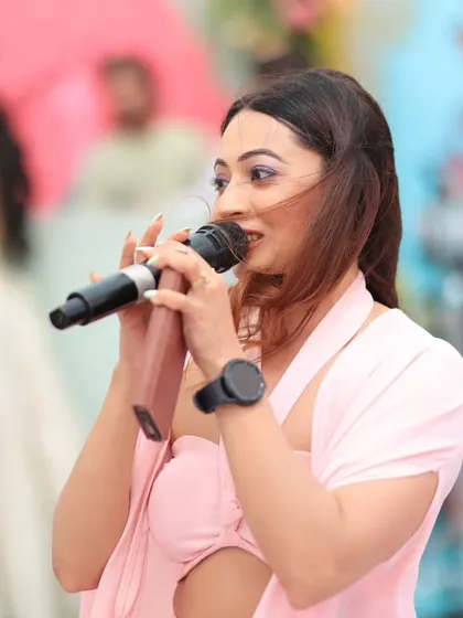 A close-up shot of me in my element, hosting a wedding carnival at The Leela Jaipur. My focus is always on the guests and making sure they are having an incredible time.