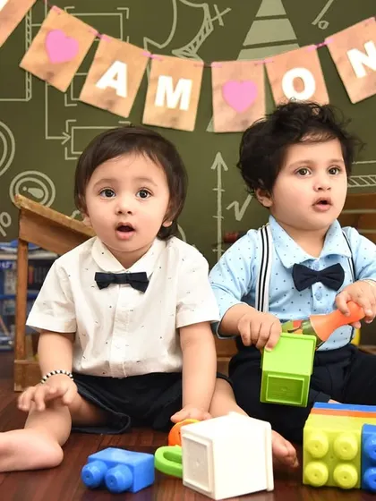 Double the trouble, double the fun! A playful school-themed shoot for these twin boys, surrounded by colorful blocks and learning toys.
