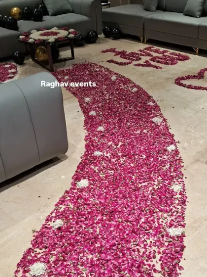 A close-up of the rose petal pathway and floor decorations. This is a perfect way to add a romantic touch to any celebration at home.