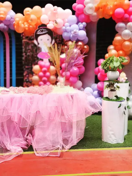 A close-up of the main table, showing the fluffy tulle skirt that mimics a ballerina's tutu.