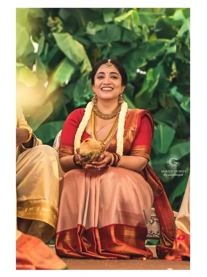 Chinvatha's radiant smile during her wedding ceremony. Her makeup was intentionally kept minimal and natural, focusing on clean skin to let her joyful personality and authentic beauty be the highlight.