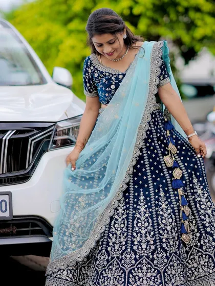 That glow when the outfit is just right. This client is rocking a custom navy blue velvet lehenga with silver embroidery, paired with a delicate sky-blue dupatta. It’s a regal look perfect for a reception or sangeet night.