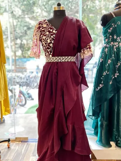 A full view of the designer ruffle ready-to-wear saree. This outfit provides the elegance of a saree with the ease of a gown, making it a popular choice for clients who want a stylish, hassle-free option.