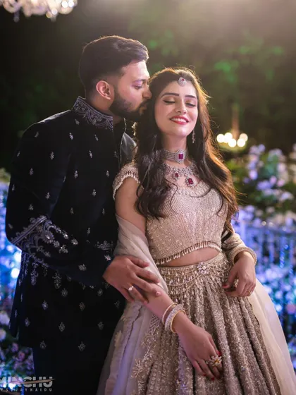 A sweet, romantic moment between the couple. Mahima's makeup looks flawless up close, with a soft glow that enhances her happy expression.