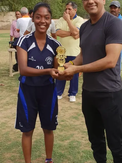 A promising young player from our academy receiving the "Future of the Basketball" award from a respected IAS Officer. Recognizing and encouraging potential is a key part of our youth development program.