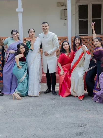 A wedding is also about the fun, quirky moments with your favorite people. This group photo captures the playful dynamic between the couple and their friends, a memory filled with personality.