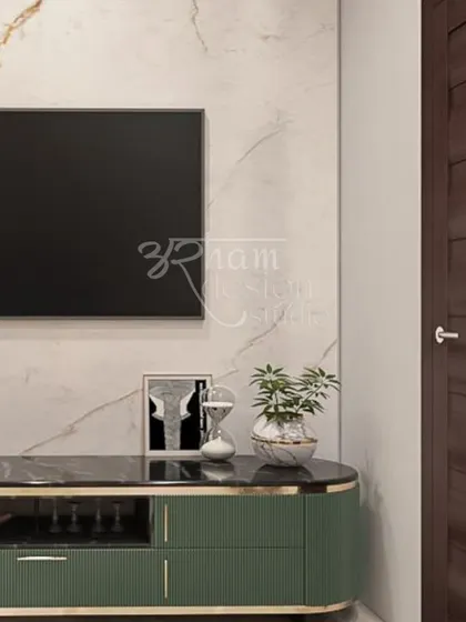 This detail shot shows a custom-designed TV console in a striking green finish with elegant gold trim. The curved edges soften the silhouette, creating a piece that is both a storage unit and a statement of style.
