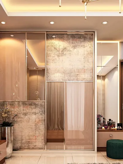 This sliding wardrobe features a unique design with textured and mirrored panels. The abstract pattern adds an artistic touch, while the integrated vanity nook provides a compact and functional dressing area.
