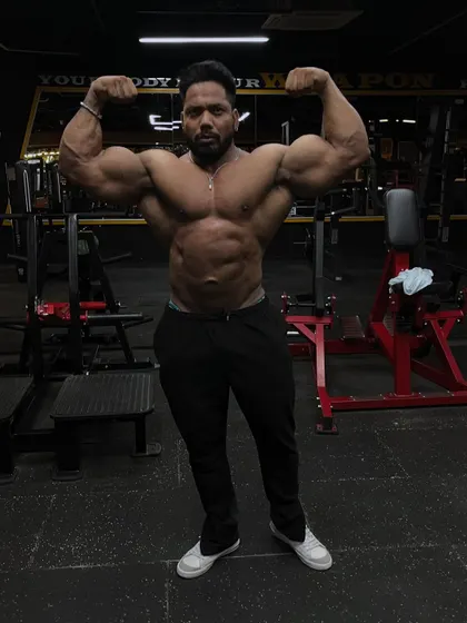 A front double bicep pose.