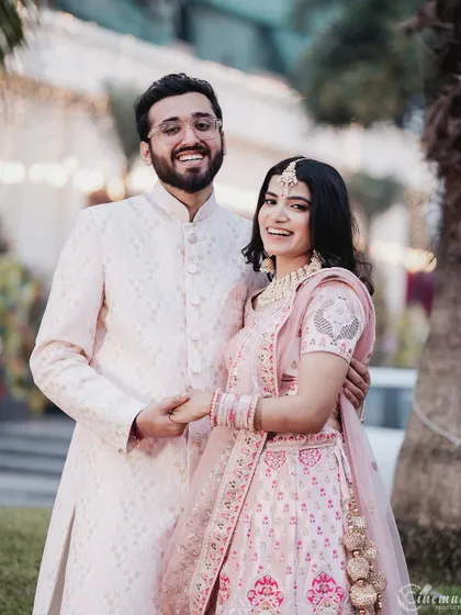 A bright and happy portrait of a couple in their engagement attire. Their wide smiles and direct look at the camera make this a wonderful, classic shot to announce their union.