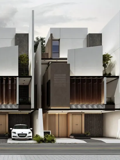 This design for a row of contemporary residences uses large, angled privacy walls to create distinct visual separation between units. The minimalist palette of concrete and wood is applied with a focus on clean geometry and urban harmony.
