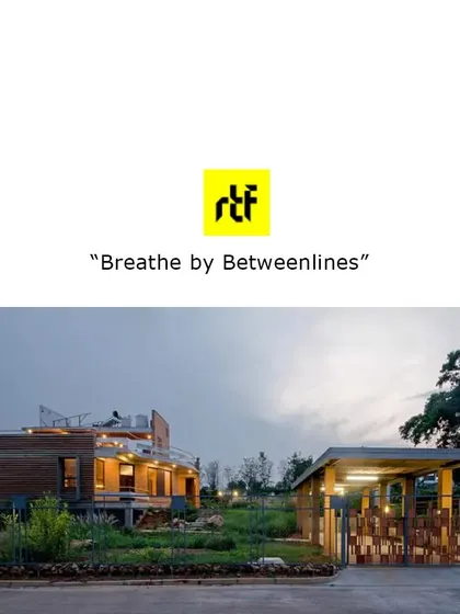 A wide shot of the "Breathe" house at dusk, as featured in a publication. The warm interior lighting contrasts with the cool tones of the evening sky.