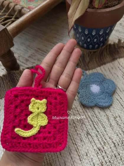 A bright pink pouch with a little yellow cat applique. We love creating custom designs like this to match your personality.
