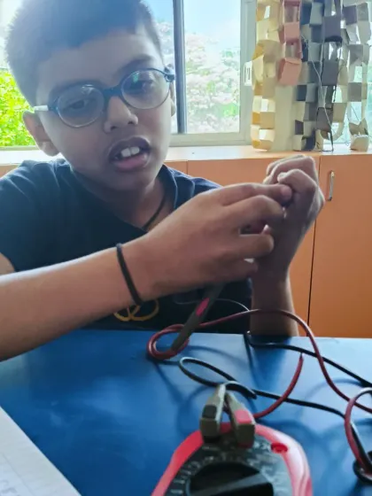 Learning about electrical continuity and resistance with a multimeter. These foundational concepts are crucial for troubleshooting circuits in our electronics workshops.