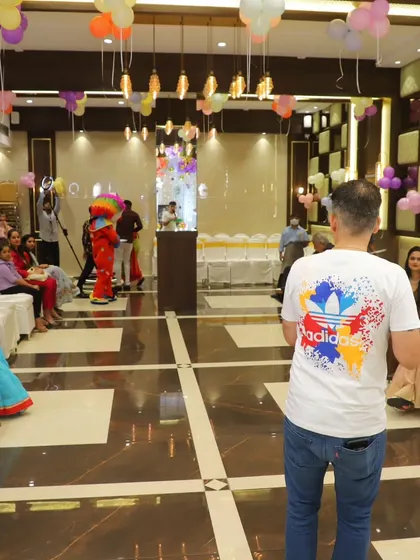 Addressing the audience from the center of the room. I make sure to move around and engage with all your guests.