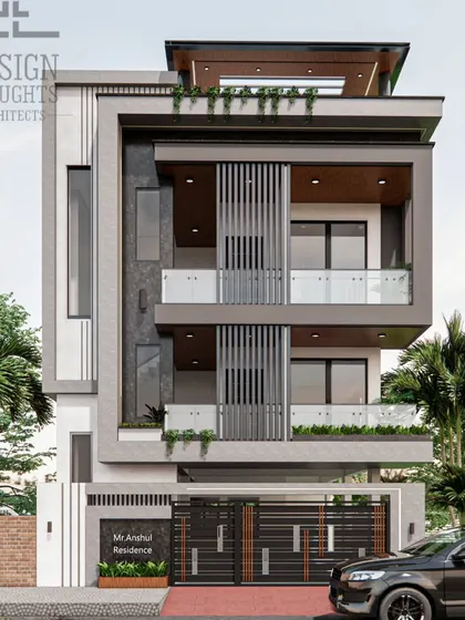 This minimalist contemporary home in Raisandhra was designed for our NRI clients. The 30x50 plot houses a 3BHK rental unit and a 2BHK duplex, showcasing our expertise in modern multi-family home design.