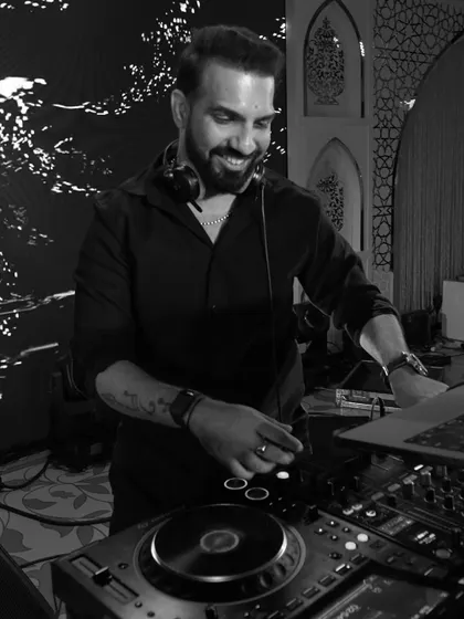 Another black and white of me smiling, lost in the music I'm creating. Just follow the beat.