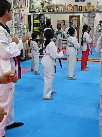 A class of senior students practicing their forms.