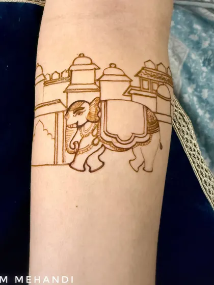 The outline of a royal elephant in front of a palace. This is the first step in creating a majestic and traditional Rajasthani-style design.