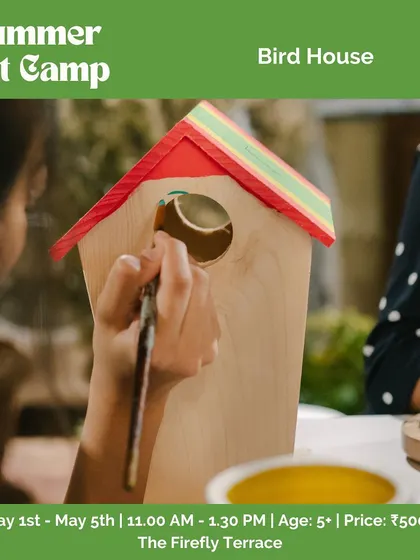 Another shot of a child painting a birdhouse during our summer art camp.