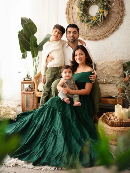 So much love in one frame. This family portrait in my cozy, boho-themed studio setup captures a relaxed and happy moment between parents and their two boys.