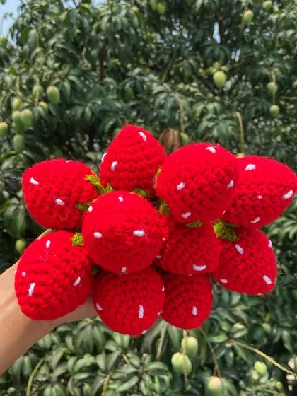 A handful of my plump and sweet crochet strawberries.