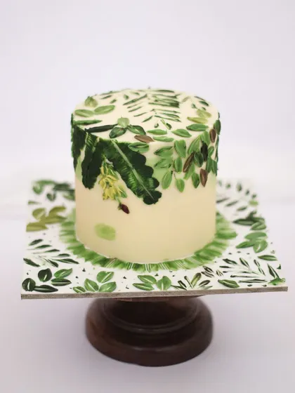 For this tropical jungle cake, I even tried my hand at painting a banana tree! It was a fun challenge. This cake is perfect for a "Wild One" birthday theme or for any nature lover.