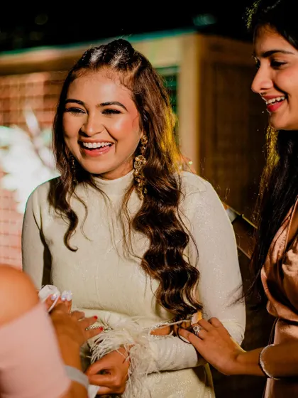 For a cocktail party, I created this edgy look with tight braids on top and soft waves. It's modern, chic, and perfect for a night of dancing.