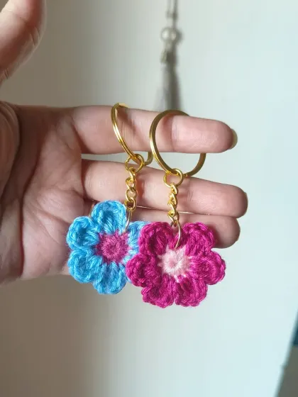 A pair of our floral crochet keychains in blue and pink. These are a cute and popular choice for return favors.
