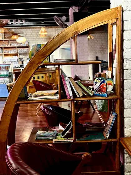 I've set up a small library with a variety of books for you to enjoy. It's all about creating a space where you can truly relax.