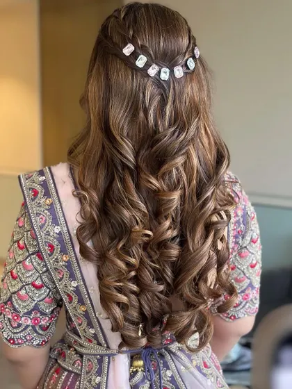 A closer view of the beautiful braided detail and the bouncy curls, perfect for a Mehendi or Sangeet.