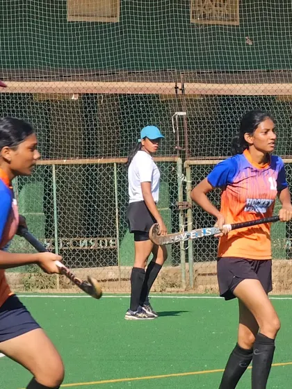 Two of our players, focused and determined, during the semi-final match at the St. Peter's Youth Centre. Their concentration and skill were key to our win.