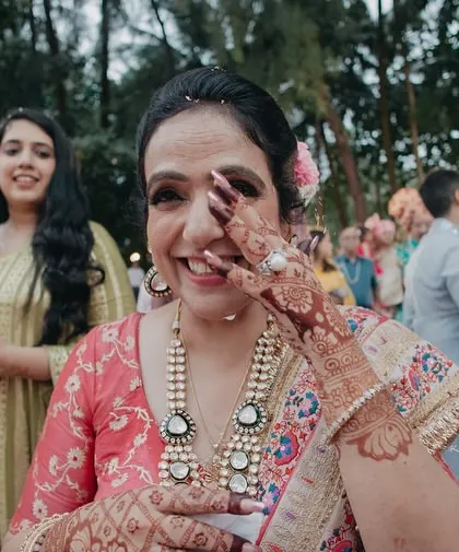 A guest wiping away a happy tear during the ceremony. Capturing the raw emotions of family and friends is a key part of our storytelling approach.