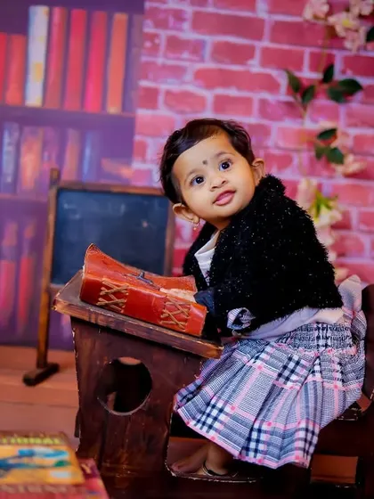 A gallery of our popular school and library theme. These images show the versatility of the brick wall backdrop, mini school desk, globe, and book props for creating a variety of scholarly and classic portraits.