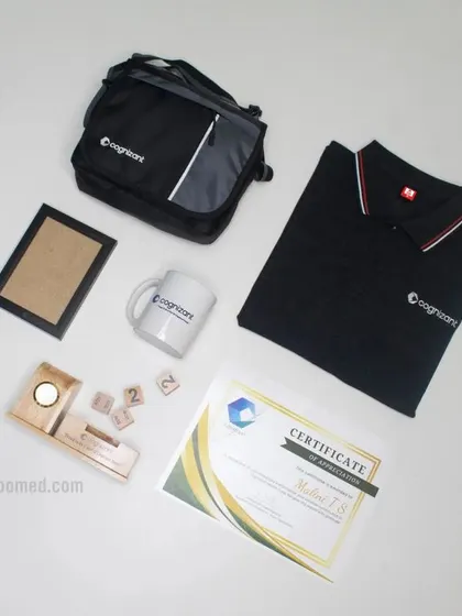 This custom joining kit for Cognizant includes a branded polo shirt, a messenger bag, a mug, a certificate, and a unique desktop item, showing how we can tailor kits to include awards and company-specific items.