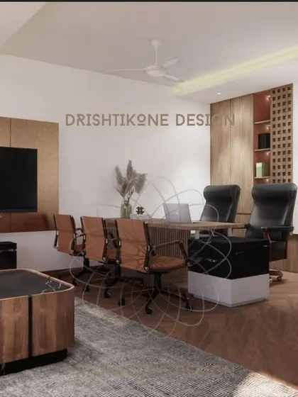 This angle showcases the meeting area within the office, with comfortable leather chairs and a large screen for presentations. The space is designed to be both professional and welcoming.