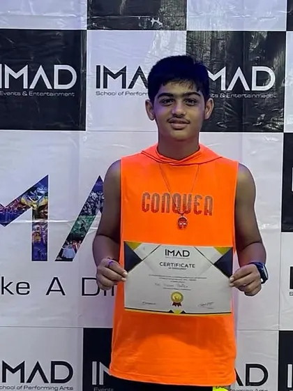 A solo shot of one of our dedicated teen students with his certificate.