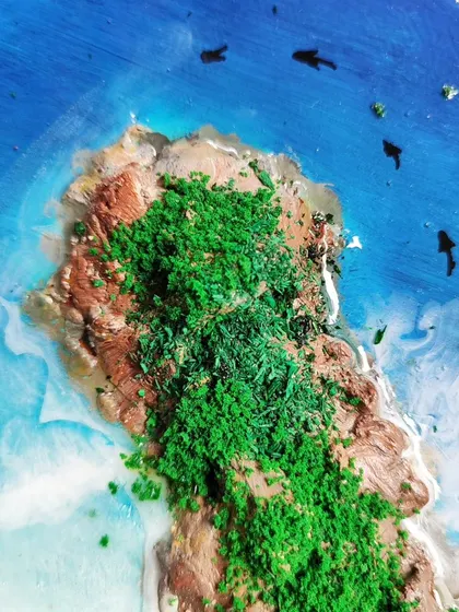 A macro shot of the green island texture on the heart-shaped resin art.