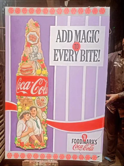 The completed "Add Magic" poster, held by me to show its large size. These pieces are perfect for event backdrops and photo opportunities.