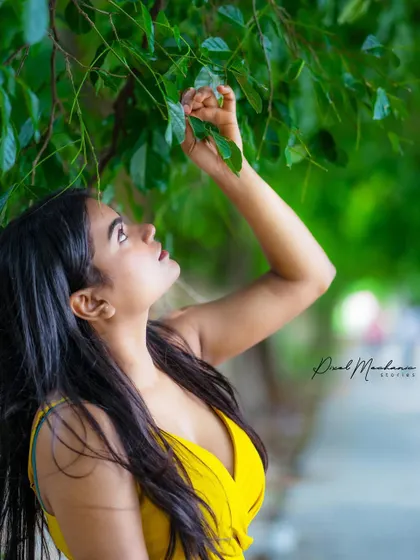 Looking up at the leaves, this shot feels candid and natural. It's a softer moment from our otherwise bold and bright prop-based session.