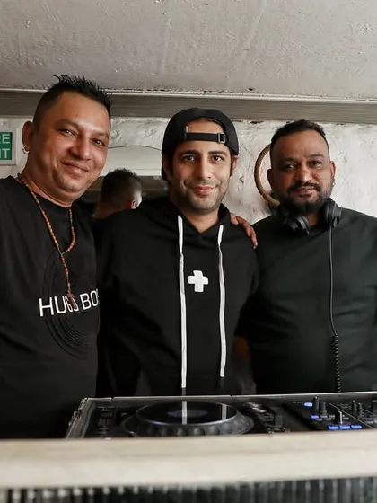 A group photo behind the decks. The DJ booth is the control center of the party, and it's always great to share the space with friends and fellow artists.