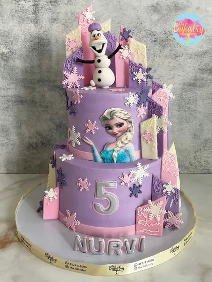 A magical Frozen-themed cake for Nurvi's 5th birthday, in a beautiful purple and pink color scheme with Elsa and Olaf.